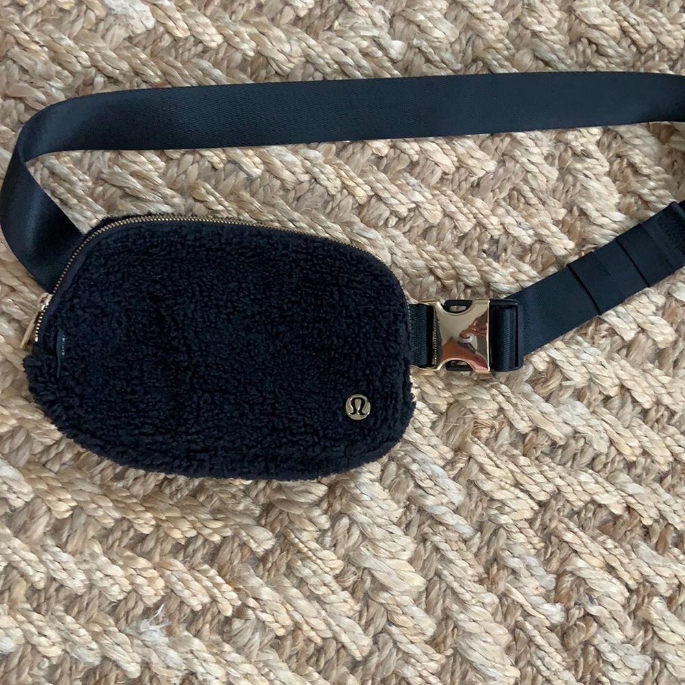 Lululemon black fleece (on front) and gold crossbody. Like new .